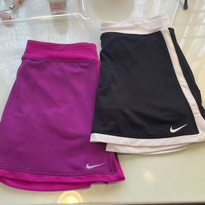 set of nike girls dry-fit tennis skirts! (purple/pink and white/black)